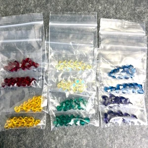 144 Stck. - 6 mm Kristall Doppelkegel Perlen - Regenbogenfarben - Swarovski? destash - Bild 1 von 7