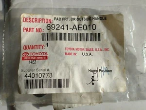 69241-AE010 TOYOTA OUTSIDE HANDLE PAD. FRONT DOOR 2004-13 TOYOTA MODELS. - Picture 1 of 3