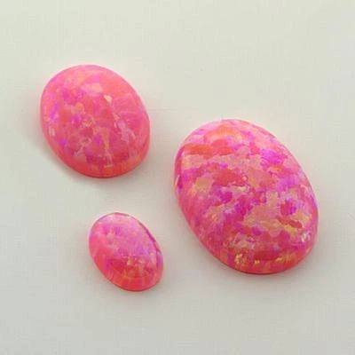 (7x5mm - 14x10mm) Salmon Pink Lab Created Opal Oval Cabochon (flash of colors) - Image 1 of 4