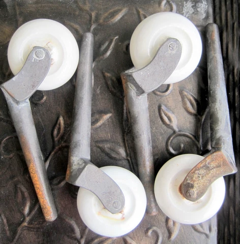 Vintage Large White Ceramic Wheels Casters Diameter is about 1 3/4" Post  4 1/4" Cover