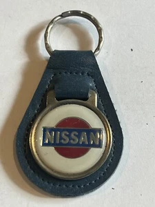 LLAVERO/LLAVERO/LLAVERO CUERO ORIGINAL “NISSAN” VINTAGE🇺🇸1970 👀LQQK👀 - Imagen 1 de 3