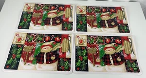 Juego de 4 manteles individuales de Navidad muñeco de nieve cabaña de Papá Noel vintage vinilo de vacaciones Wal-Mart - Imagen 1 de 3
