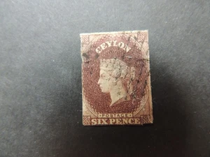 1857 Ceylon 6d purple-brown imperf SG6 Used THINNING TO CENTRE AND TOP RIGHTHAND - Picture 1 of 2