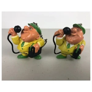 Vintage Gummi Lotto Mann MIT Lautsprecher Schlüsselanhänger Lotterie Figur Keychain 2 Stck. - Bild 1 von 10