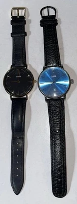 Par de relojes de cuarzo Cluse, correas de cuero negro, unisex, baterías nuevas Foto 1 de 4