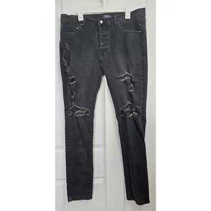 Amiri Herren Distressed Faded Black Skinny Jeans mit Camo Patches - Gr. 38 - Bild 1 von 9