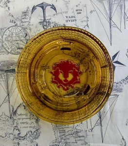 Vintage Red Lion Hotels 5" Amber Glass Ashtray Motor Lodge Casino - Imagen 1 de 2