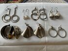 7 pairs of silver statement earings