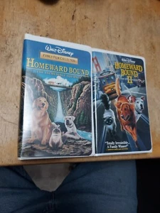 2 nastri VHS Walt Disney rilegati verso casa 1 e 2 custodie a conchiglia / usati - Foto 1 di 7