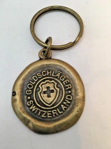Vintage Brass Goldschlager Switzerland Key Chain  -  1-1/4" Diameter - Picture 1 of 3
