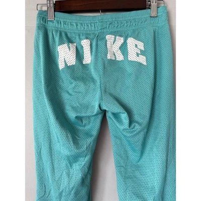 Pantalones deportivos vintage Y2K Nike de malla verde azulado para mujer XS tiro bajo piernas con botones Foto 1 de 4