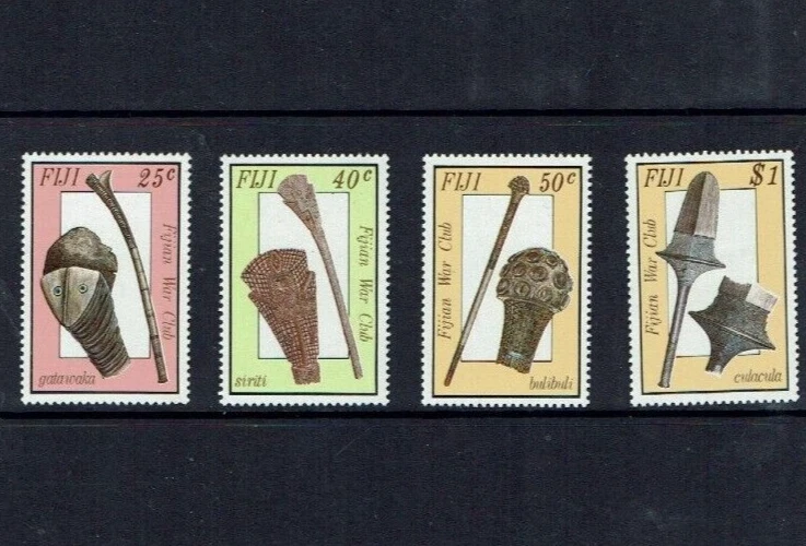 JUEGO DE 4 SELLOS DE PALOS DE GUERRA ARMAS DE GUERRA ANTIGUAS FIJI 1986 COMO NUEVOS Foto 1 de 1
