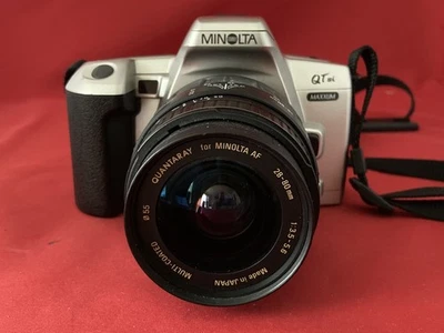 Minolta Maxxum QTsi 35mm film camera w/28-80mm mini zoom lens and camera strap - Image 1 of 4