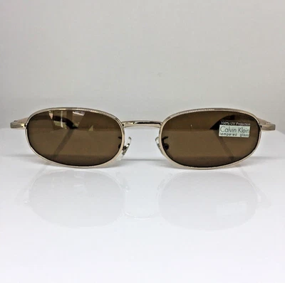 New VINTAGE CALVIN KLEIN CK 157 Sunglasses CK 157S Col. 510 Shiny Gold Italy - Image 1 of 4