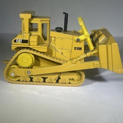 Trator tipo pista escavadeira ERTL Caterpillar D10N modelo fundido 1:50 - Imagem 1 de 4