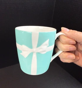Tiffany & Co. Blue Embossed Bow with White Ribbon Cup Mug - Picture 1 of 9