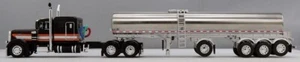 1/64 DCP SCHWARZ SILBER ORANGE PETERBILT 379 60" KOJE MIT QUAD ACHSE MILCHTANKER NEU IM KARTON - Bild 1 von 5