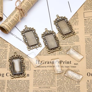 Set 6 pendenti in lega tibetana lunetta rettangolare filigrana e coperchi 38x19 mm - Foto 1 di 5