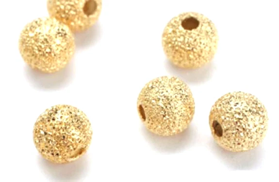 10 preciosas cuentas redondas chapadas en oro polvo de estrellas 12 mm Foto 1 de 1