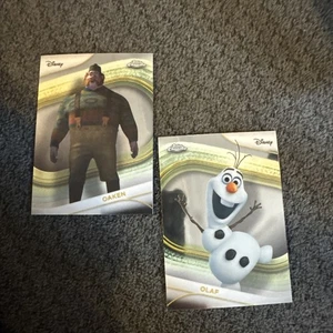 2025 Topps Chrome Disney 114 Oaken,113 Olaf - Bild 1 von 2