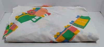 VINTAGE CHILDREN’S MULTICOLOR TRAIN ALL OVER PRINT 60” X 90” BEDSHEET/FABRIC - Image 1 of 4