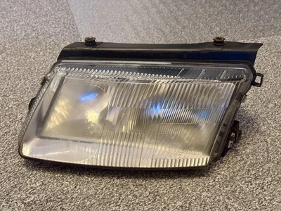 VW Passat 3B Scheinwerfer links Original H7 H4 NSW Hella 14869100 - Bild 1 von 4