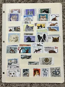WORLDWIDE ANIMAL STAMPS LOT IN STOCK PAGE REPTILES, CATS, DOGS, HORNED & MORE - Picture 1 of 10