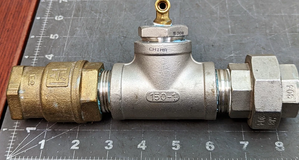 1" Tee, Union, 1” x ¼” Hex Bushing, Brass Check Valve #150 Cast 304 SS [A4B2] - Image 1 of 4