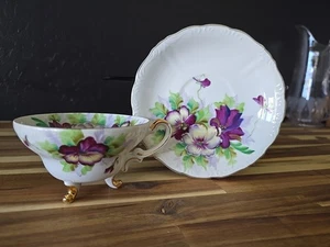 Saji Fancy Porcelain China 3 Footed Tea Cup & Saucer Violets Gold Accents Japan - Picture 1 of 8