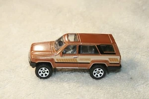 NEW Matchbox 💥 1985 SANDY BROWN METALLIC TOYOTA 4 RUNNER 💥Japan Cruisers LOOSE - Picture 1 of 8
