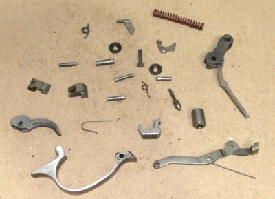 WALTHER TPH .22LR TRIGGER, HAMMER, TRIGGER GUARD, BAR, MAG CATCH, STRUT, SPRING. - Image 1 of 4