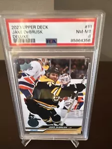 2023-24 Upper Deck Series 1 - Jake DeBrusk #11 Deluxe PSA 8 59/250 - Imagen 1 de 3