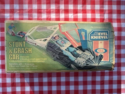 VINTAGE IDEAL EVEL KNIEVEL STUNT  CRASH CAR  WORKING  MOTORCYCLE LOT WITH BOX - Image 1 of 4