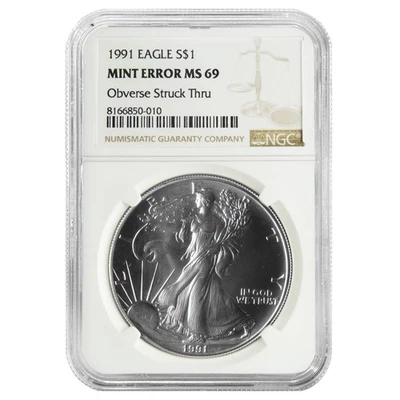 1991 $1 American Silver Eagle NGC MS69 Mint Error Obverse Strike Thru - Image 1 of 2
