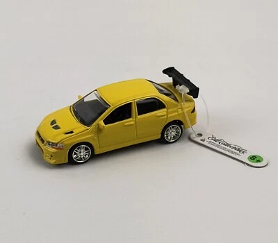 Fast & Furious Yellow Mitsubishi Lancer Evo VII 1:64 Ertl Collectibles Car 2002 - Image 1 of 4