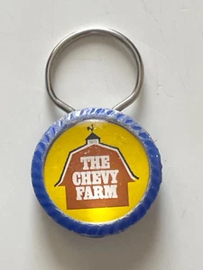 Llavero promocional escaso THE CHEVY FARM SCHAFER CHEVROLET PONTIAC Pinconning MI BONITO - Imagen 1 de 2