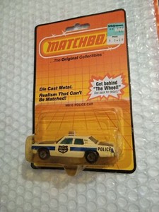 1984 Matchbox MB10 Police Car With Crease, Cracked Blister, Dings, & Sticker 