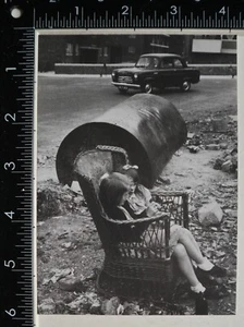 VINTAGE POSTCARD LONDON EAST END 1954 2 LITTLE GIRLS ON WICKER SEAT IN STREET - Picture 1 of 2