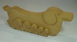 altes NAEF HOLZPUZZLE Dackel Welpen von Sabu Oguro Design Hund Holzspielzeug - Bild 1 von 4