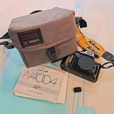 Cámara fotográfica Nikon N4004 SLR De colección Sistema maestro de decisión Japón 35 mm AF QD Correa Foto 1 de 4