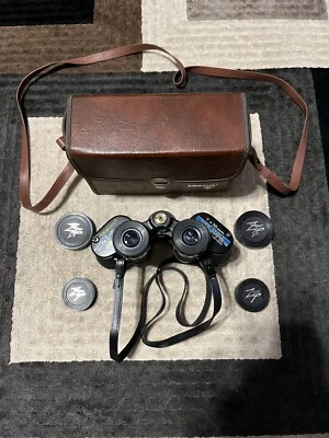 Tasco Zip 318Z Wide Angle 7 x 35 mm Binoculars with Case, 4 Lens Covers, Straps - Image 1 of 4