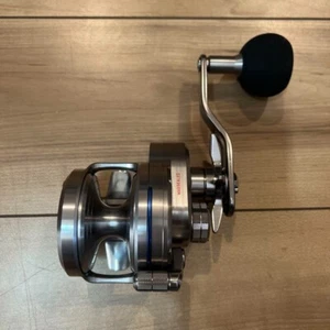 Daiwa SALTIGA 35NH Silver Metal Right-Handed Used From Japan - Picture 1 of 10