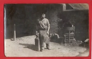 VILLAGE BLACKSMITH POSES IN THE SMITHY. RP - Imagen 1 de 1