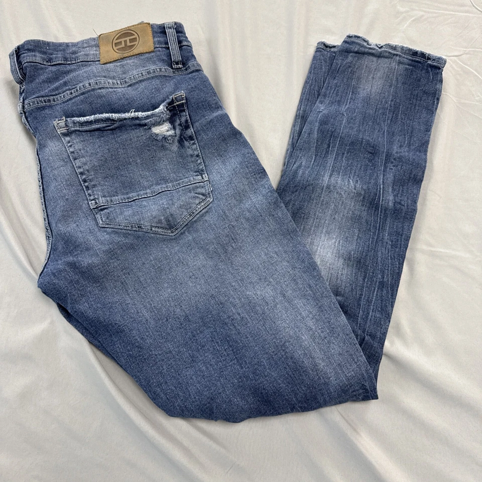 Pantalones de mezclilla ajustados Jordan Craig Ross para hombre talla 34 x 32 rasgados elásticos desgastados Foto 1 de 4