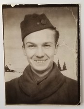 Vintage Photobooth Arcade Photograph Smiling Soldier Side Cap Winter Background