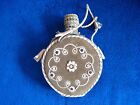 VINTAGE ROMANIAN FLASK WITH DECORATIVE SUADE AND LEATHER COVER FLOWER MOTIF