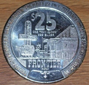 $25 1986 SILVER VINTAGE SLOT TOKEN FROM THE FRONTIER CASINO LAS VEGAS NV - Picture 1 of 2