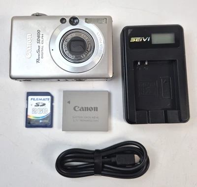 Cámara digital Canon PowerShot SD600 ELPH 6MP plateada con cargador batería tarjeta SD Foto 1 de 4