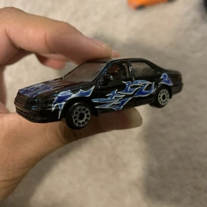 Motormax Toyota Camry años 90 XV20 #6015 negro con llamas escala 1/64 - Imagen 1 de 5