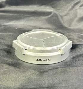 JJC ALC-X2 Tappo obiettivo automatico argento per Leica X1 X2 - Foto 1 di 2